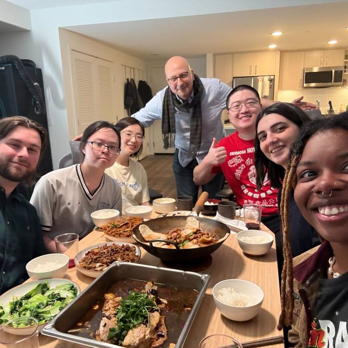 Lab members and Prof. Mesbahi at a home-cooked dinner